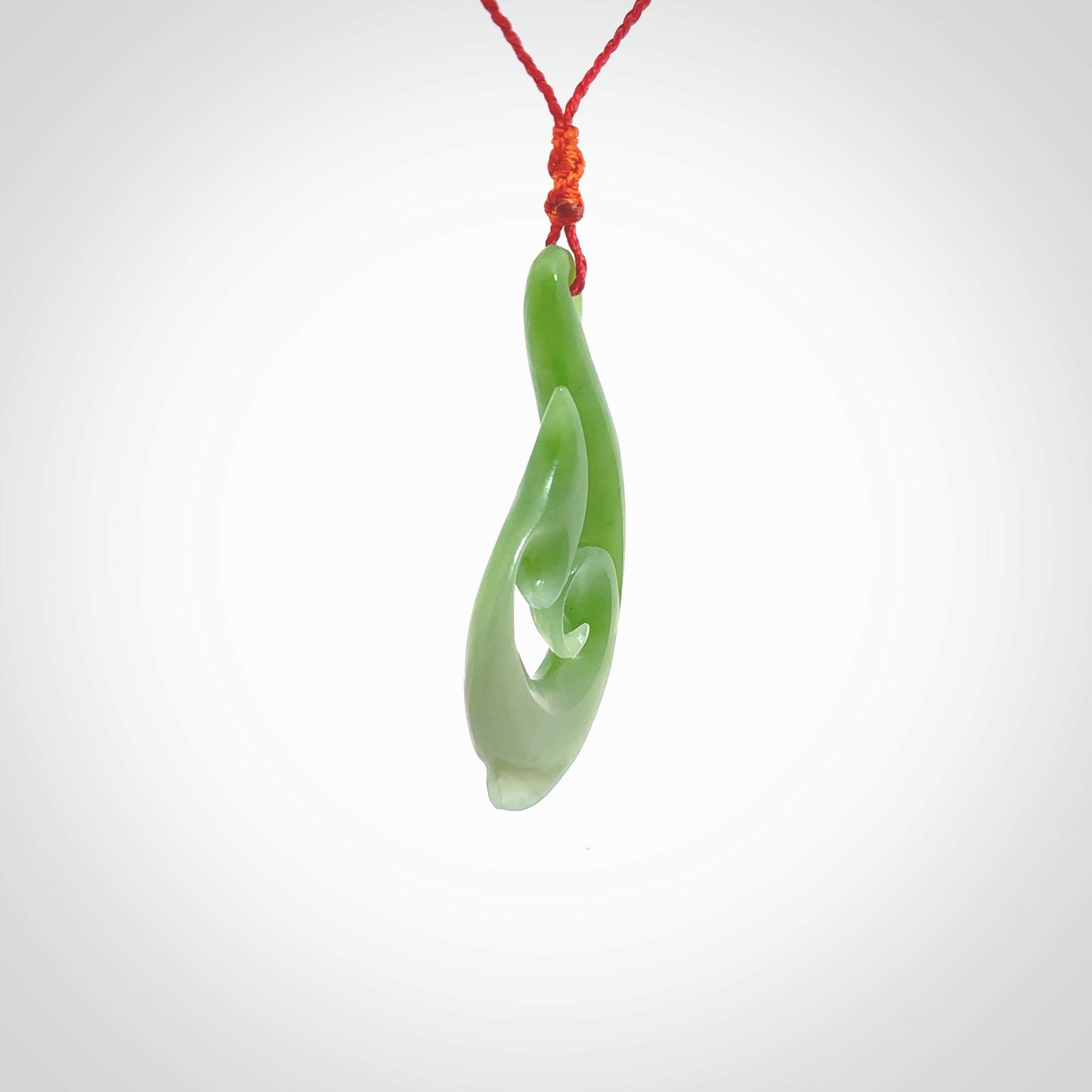 This pendant is a contemporary, large sized and beautiful koru necklace carved from New Zealand Kawakawa Jade. Ross Crump carved this piece for us so the workmanship is outstanding. Handmade in New Zealand, a beautiful piece of jade jewellery.