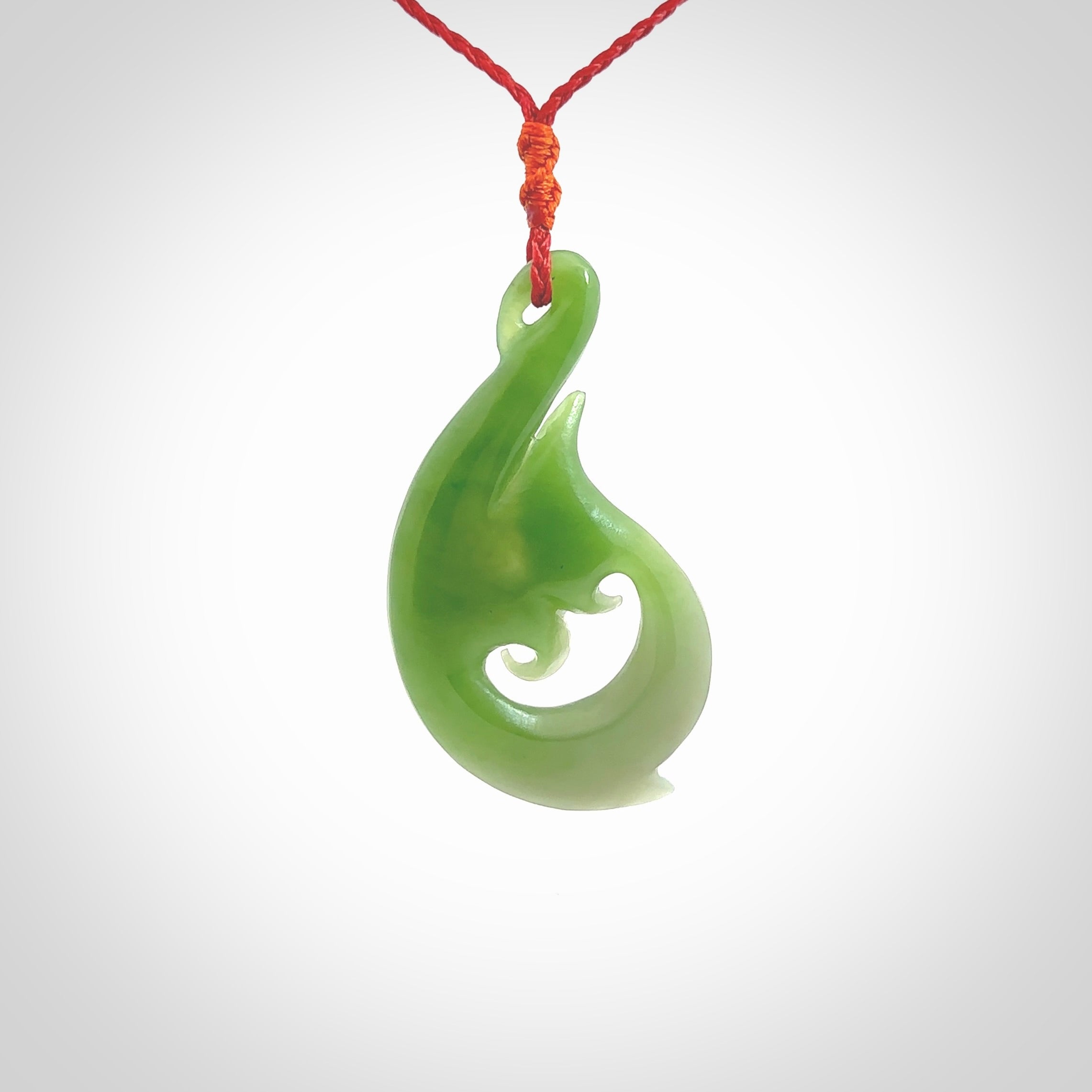 This pendant is a contemporary, large sized and beautiful koru necklace carved from New Zealand Kawakawa Jade. Ross Crump carved this piece for us so the workmanship is outstanding. Handmade in New Zealand, a beautiful piece of jade jewellery.