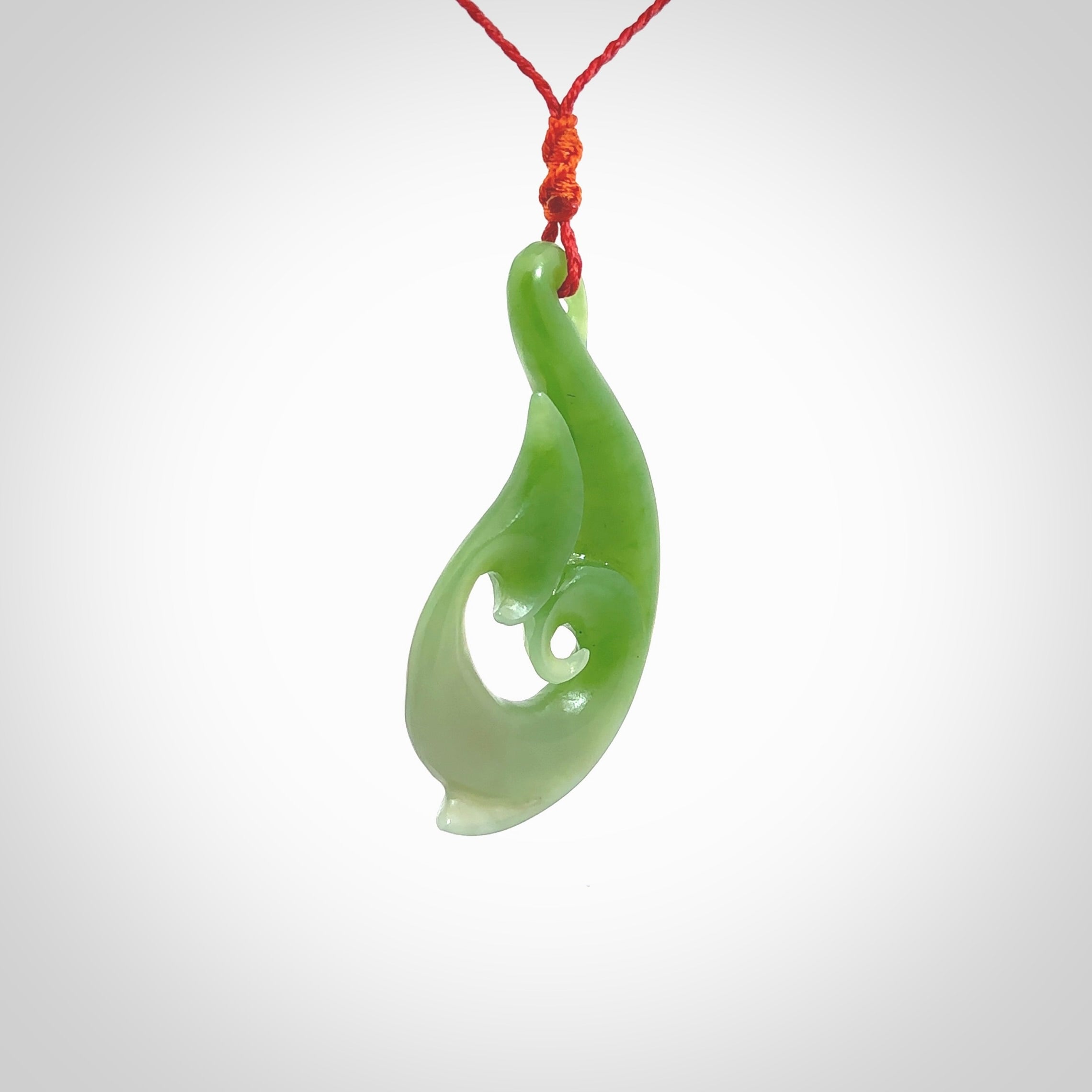 This pendant is a contemporary, large sized and beautiful koru necklace carved from New Zealand Kawakawa Jade. Ross Crump carved this piece for us so the workmanship is outstanding. Handmade in New Zealand, a beautiful piece of jade jewellery.