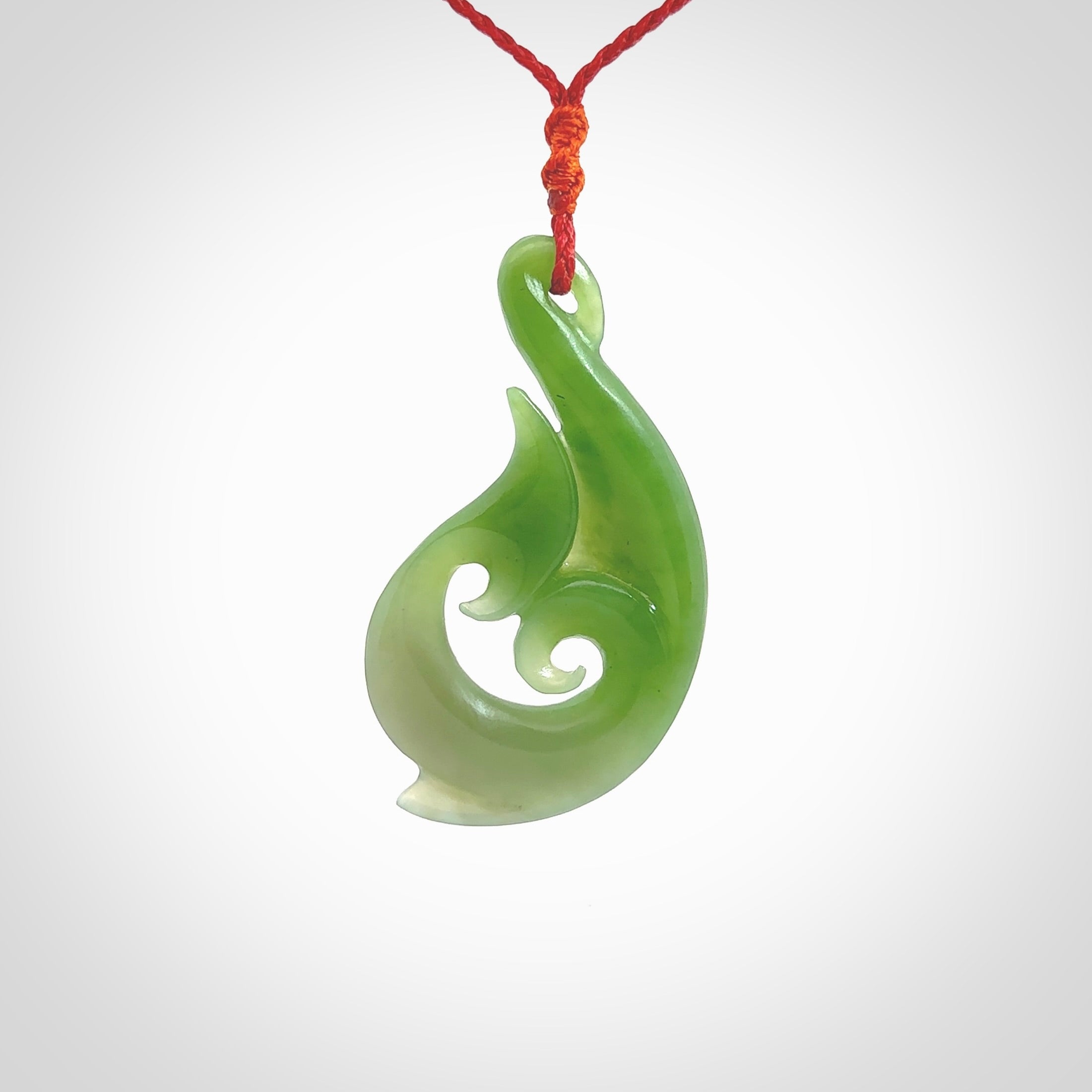 This pendant is a contemporary, large sized and beautiful koru necklace carved from New Zealand Kawakawa Jade. Ross Crump carved this piece for us so the workmanship is outstanding. Handmade in New Zealand, a beautiful piece of jade jewellery.