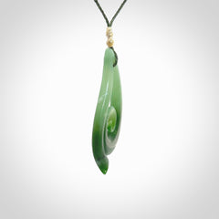 This pendant is a contemporary, large sized and beautiful koru drop necklace carved from New Zealand Inanga Jade. Ross Crump carved this piece for us so the workmanship is outstanding. Handmade in New Zealand, a beautiful piece of jade jewellery.