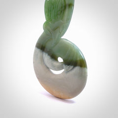 This is a one off large display piece carving, hand made by Ross Crump here in New Zealand. Ross has carved this stunning large Taniwha with twist from New Zealand Auhunga Jade. We have only one and this piece is made to be displayed as a centre piece. We deliver this spectacular piece of art to you with Express Courier. New Zealand made gift for a special occasion or corporate affair.