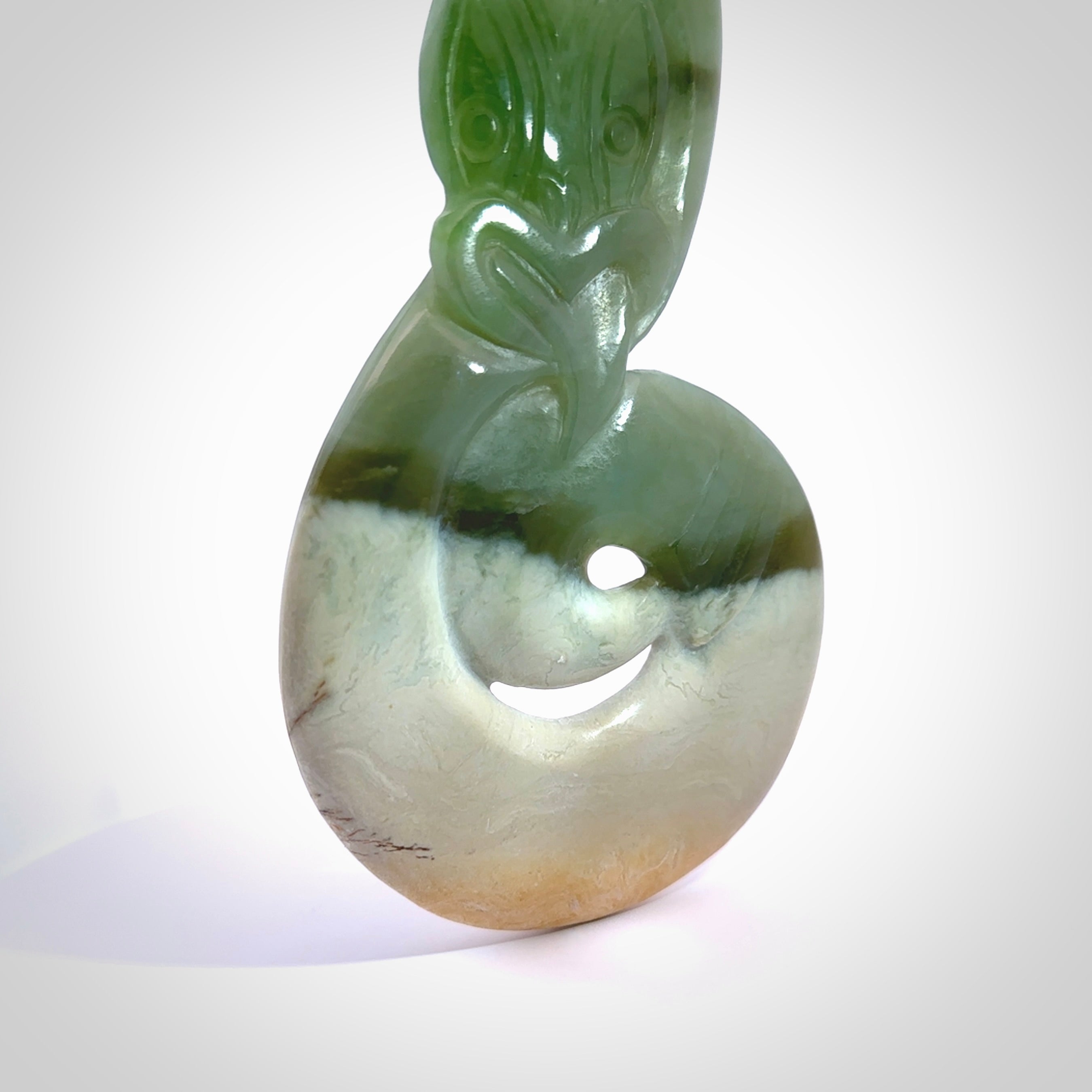 This is a one off large display piece carving, hand made by Ross Crump here in New Zealand. Ross has carved this stunning large Taniwha with twist from New Zealand Auhunga Jade. We have only one and this piece is made to be displayed as a centre piece. We deliver this spectacular piece of art to you with Express Courier. New Zealand made gift for a special occasion or corporate affair.