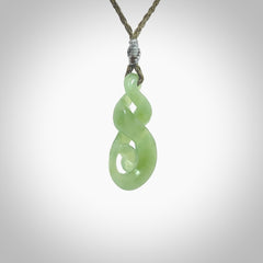 A beautiful carved, complex double twist pendant. This piece has been carved for us by Ross Crump and is a truly beautiful carving made from some of our finest and rarest Inanga jade. We will ship this to you with an express courier so you will have it quickly. A rare and beautiful work of wearable art from NZ Pacific.