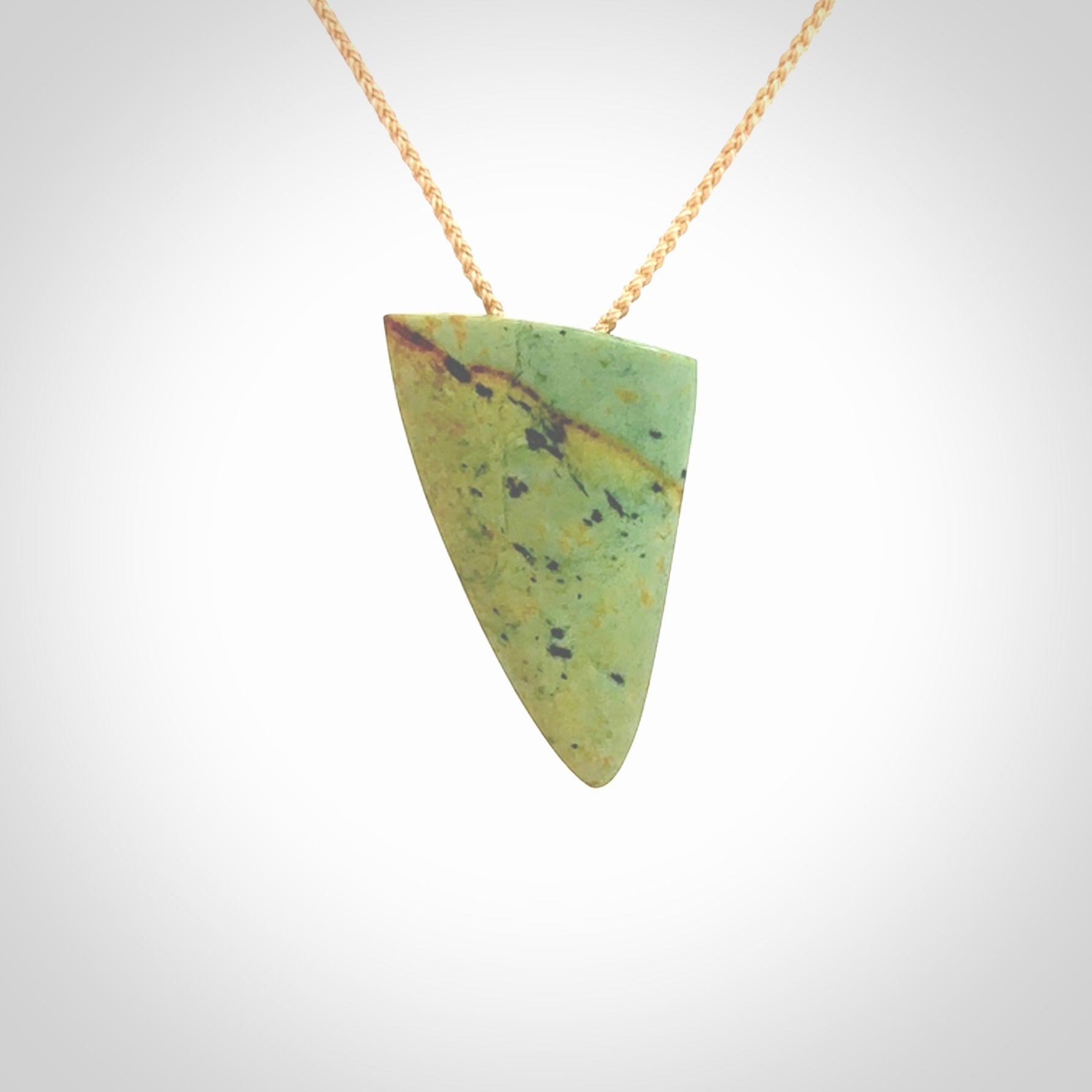 Hand carved pounamu drop pendant. Jade necklace hand made in New Zealand. A contemporary drop pendant carved from rare New Zealand flower jade. NZ Pacific jade jewellery for sale online.