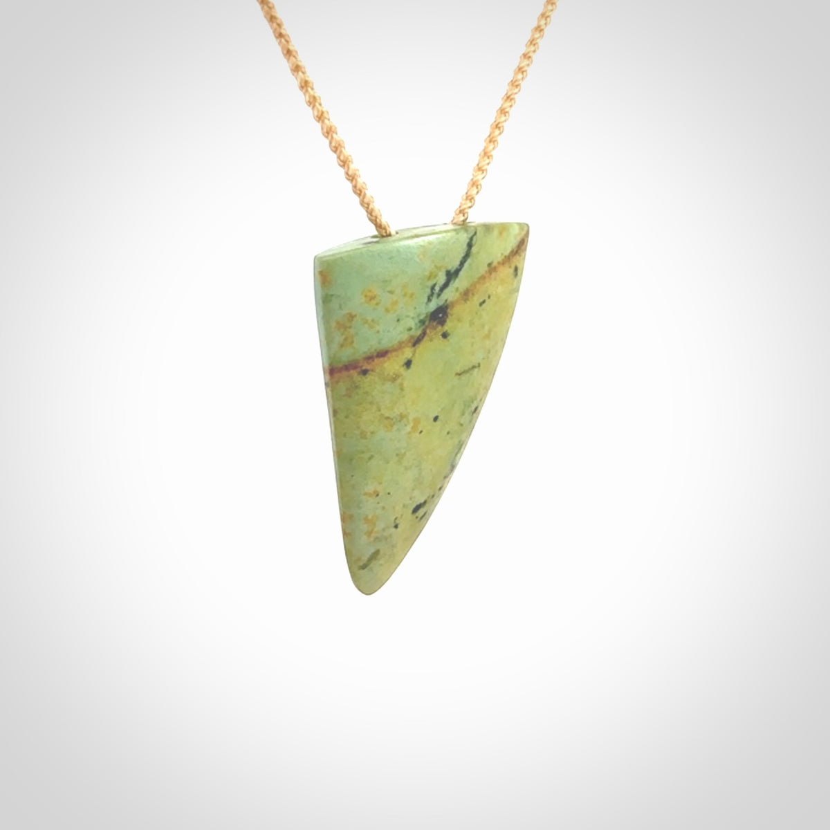 Hand carved pounamu drop pendant. Jade necklace hand made in New Zealand. A contemporary drop pendant carved from rare New Zealand flower jade. NZ Pacific jade jewellery for sale online.