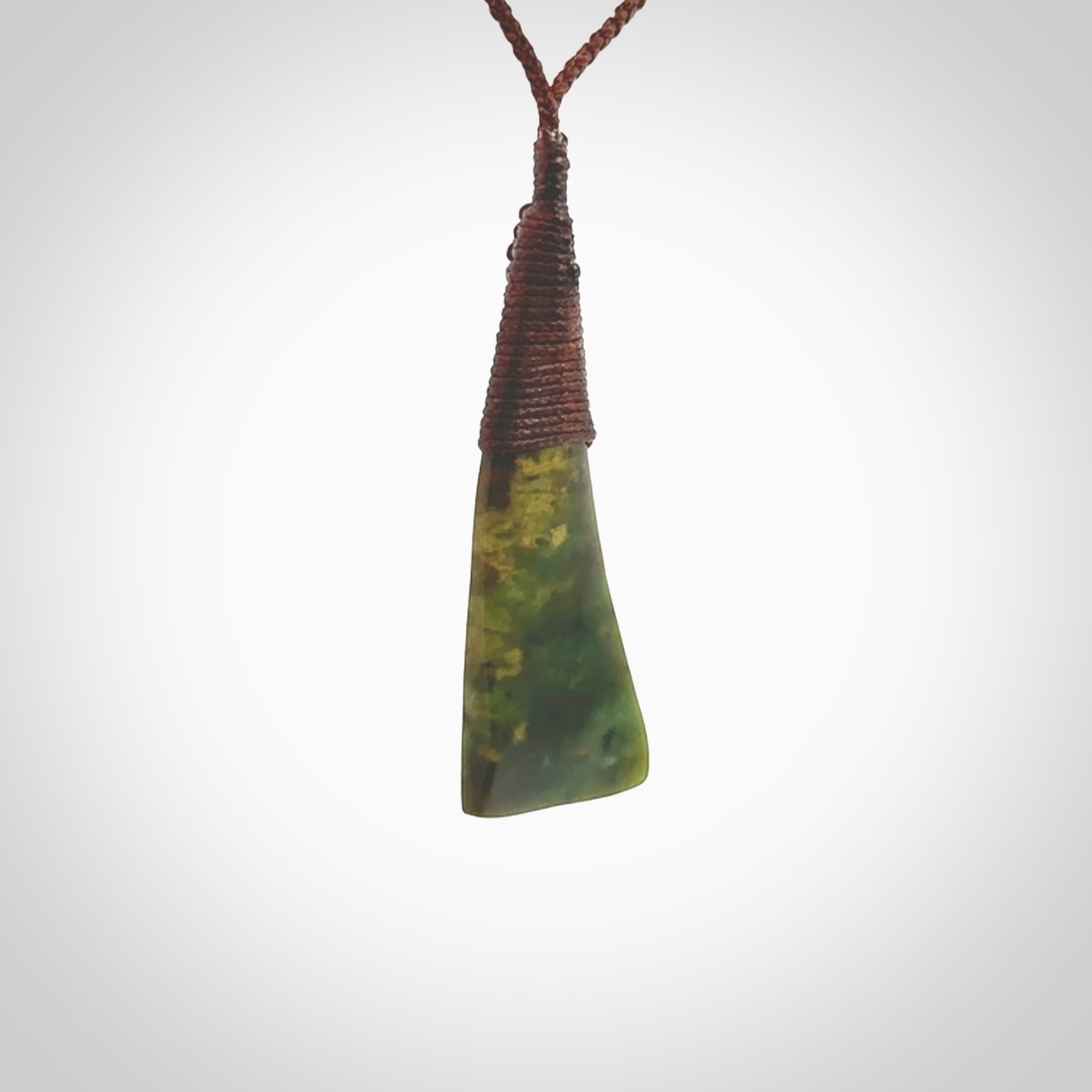 Hand carved pounamu drop pendant. Flower Jade necklace hand made in New Zealand. A drop pendant carved from rare New Zealand Flower jade. NZ Pacific jade jewellery for sale online.