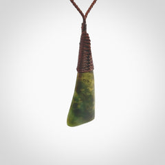 Hand carved pounamu drop pendant. Flower Jade necklace hand made in New Zealand. A drop pendant carved from rare New Zealand Flower jade. NZ Pacific jade jewellery for sale online.