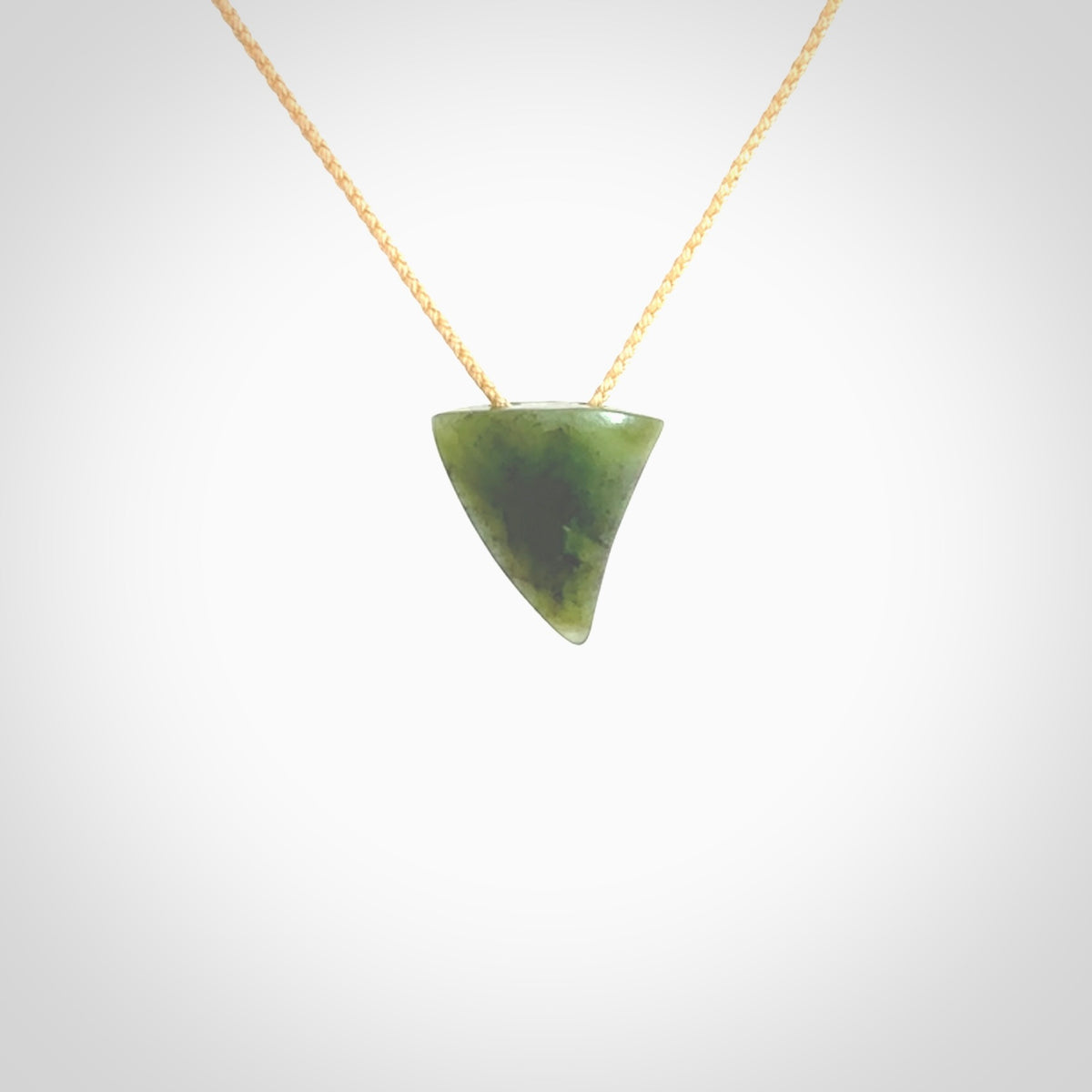 Hand carved small jade niho, fang, pendant. Carved by New Zealand artist Ric Moor. Contemporary New Zealand Jade fang, drop necklace. One only unique pendant for men and women.