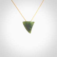 Hand carved small jade niho, fang, pendant. Carved by New Zealand artist Ric Moor. Contemporary New Zealand Jade fang, drop necklace. One only unique pendant for men and women.