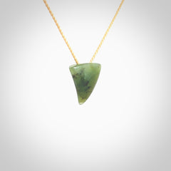 Hand carved small jade niho, fang, pendant. Carved by New Zealand artist Ric Moor. Contemporary New Zealand Jade fang, drop necklace. One only unique pendant for men and women.