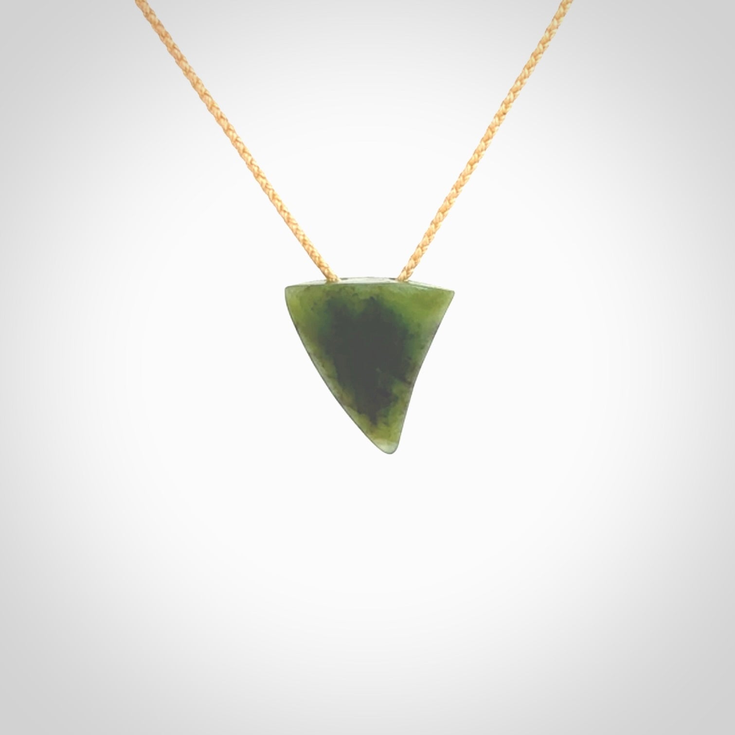 Hand carved small jade niho, fang, pendant. Carved by New Zealand artist Ric Moor. Contemporary New Zealand Jade fang, drop necklace. One only unique pendant for men and women.