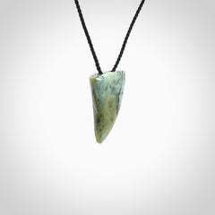 This is a lovely New Zealand Jade, pounamu drop pendant. Hand carved for us by Ric Moor. It is bound with an adjustable black coloured cord which is length adjustable. Free worldwide shipping.