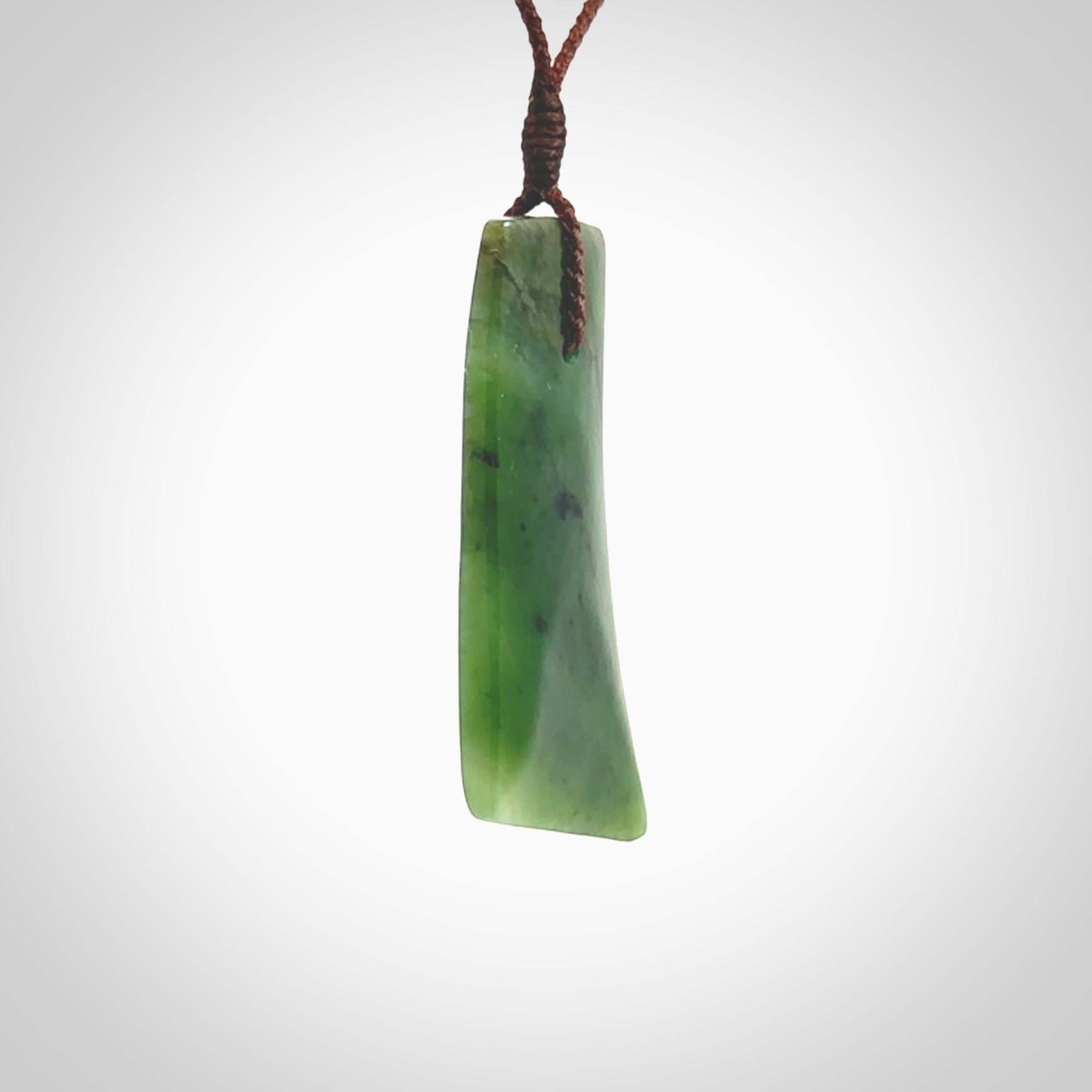 One only large New Zealand jade drop pendant. Hand carved in New Zealand by Ric Moor, jade artist, for NZ Pacific.