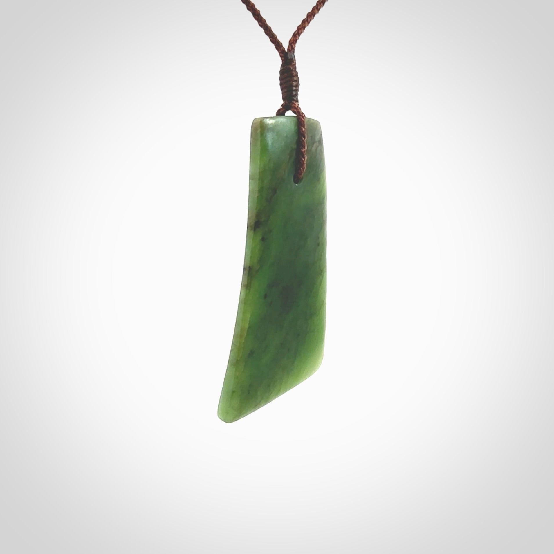 One only large New Zealand jade drop pendant. Hand carved in New Zealand by Ric Moor, jade artist, for NZ Pacific.