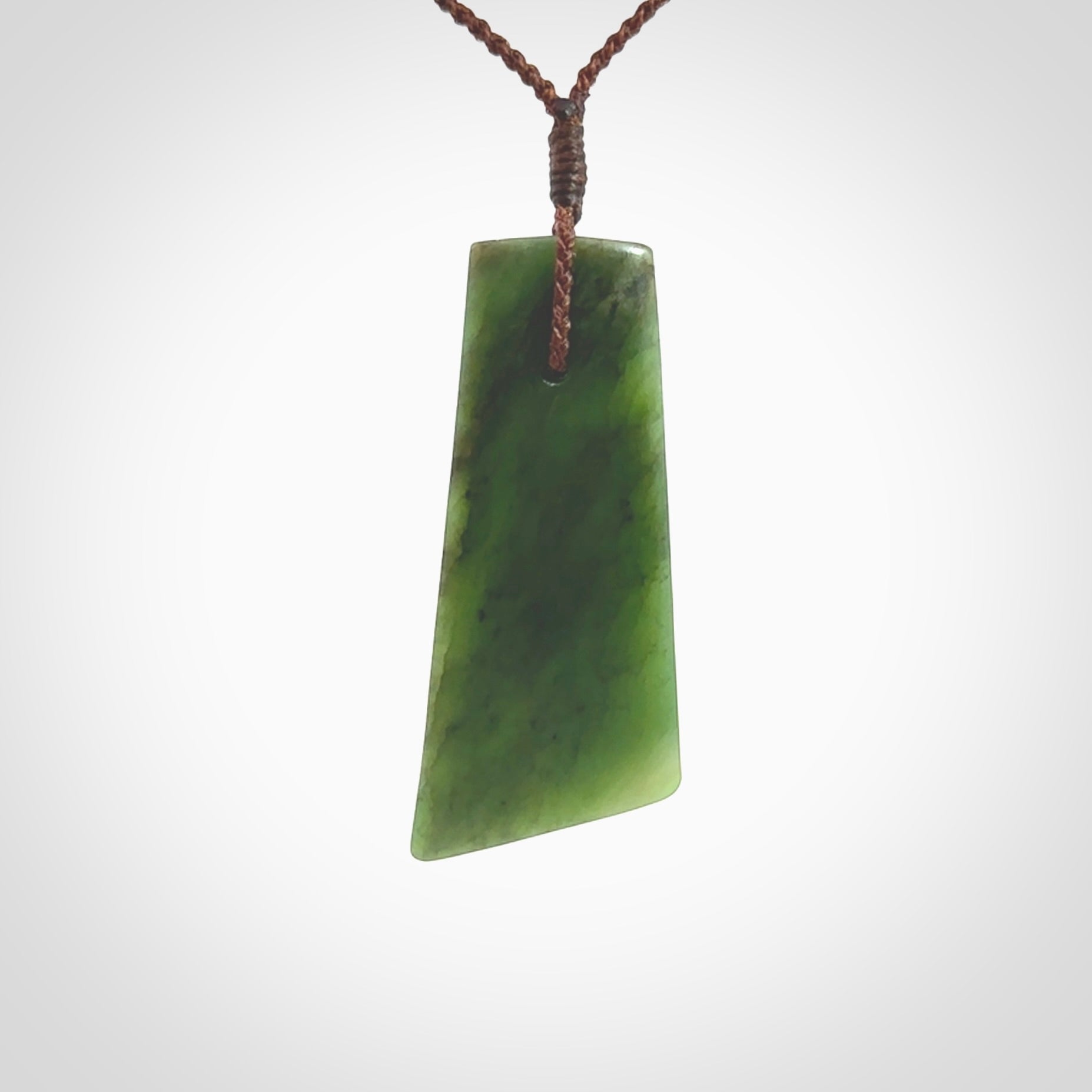 One only large New Zealand jade drop pendant. Hand carved in New Zealand by Ric Moor, jade artist, for NZ Pacific.