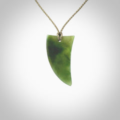 A lovely New Zealand jade drop pendant. This piece is made from a semi-translucent jade and is a wonderful deep green colour. Carved by Ric Moor for NZ Pacific and delivered worldwide. Provided with an adjustable Khaki cord.