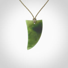 A lovely New Zealand jade drop pendant. This piece is made from a semi-translucent jade and is a wonderful deep green colour. Carved by Ric Moor for NZ Pacific and delivered worldwide. Provided with an adjustable Khaki cord.