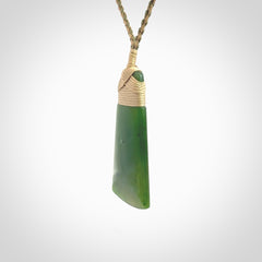 Hand made large New Zealand Kawakawa jade toki pendant. Hand carved in New Zealand by Rueben Tipene. Hand made jewellery. Unique Jade Toki with adjustable cord. Free shipping worldwide.