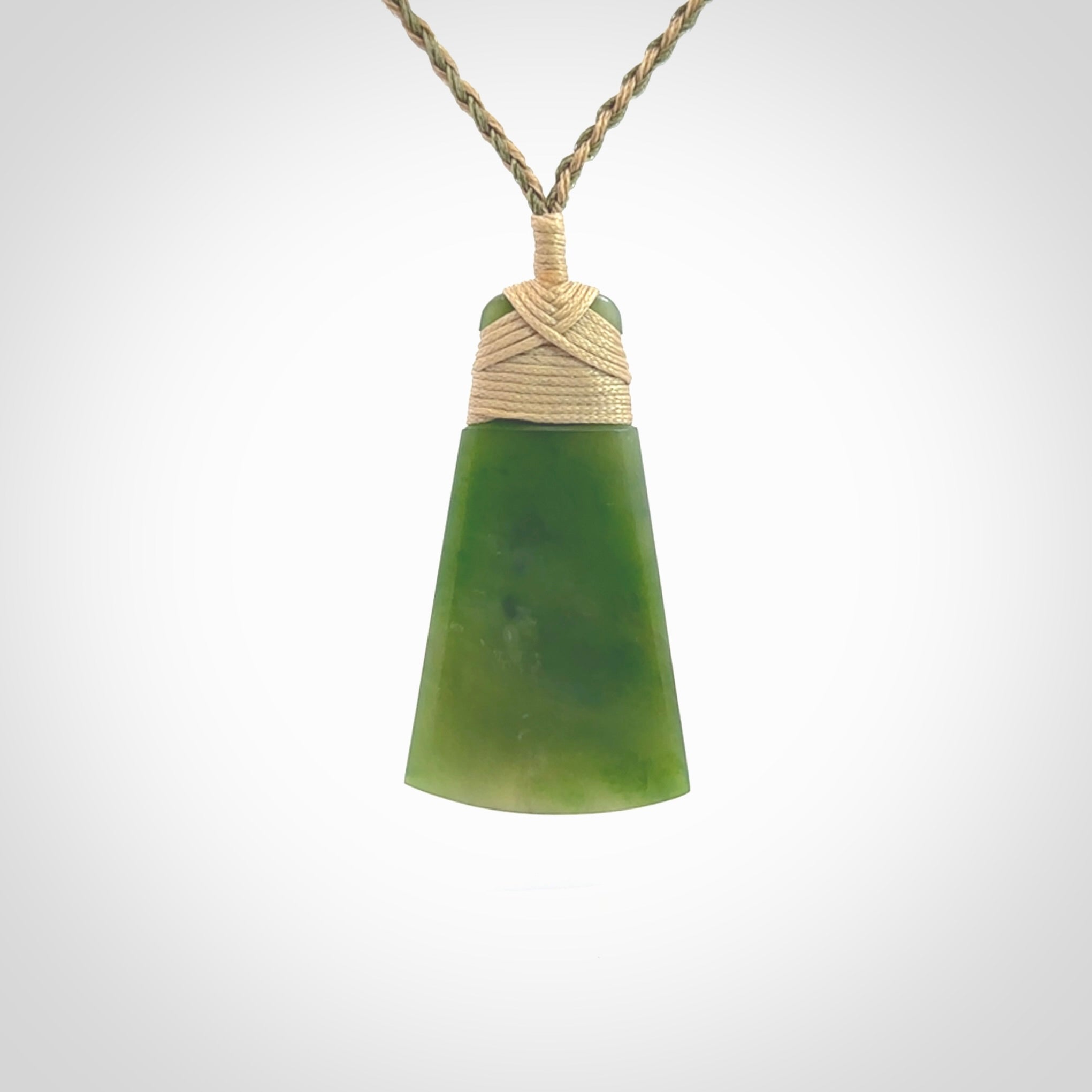 Hand made large New Zealand Kawakawa jade toki pendant. Hand carved in New Zealand by Rueben Tipene. Hand made jewellery. Unique Jade Toki with adjustable cord. Free shipping worldwide.