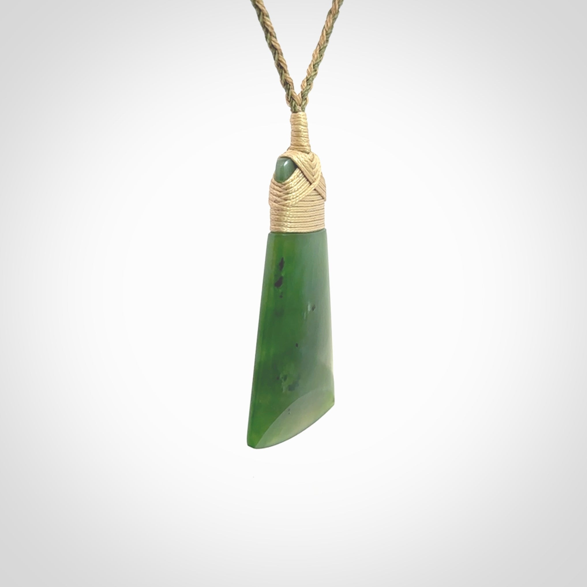 Hand made large New Zealand Kawakawa jade toki pendant. Hand carved in New Zealand by Rueben Tipene. Hand made jewellery. Unique Jade Toki with adjustable cord. Free shipping worldwide.