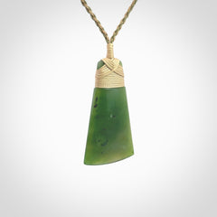 Hand made large New Zealand Kawakawa jade toki pendant. Hand carved in New Zealand by Rueben Tipene. Hand made jewellery. Unique Jade Toki with adjustable cord. Free shipping worldwide.