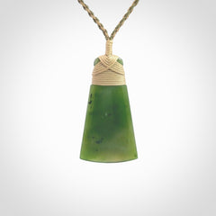 Hand made large New Zealand Kawakawa jade toki pendant. Hand carved in New Zealand by Rueben Tipene. Hand made jewellery. Unique Jade Toki with adjustable cord. Free shipping worldwide.