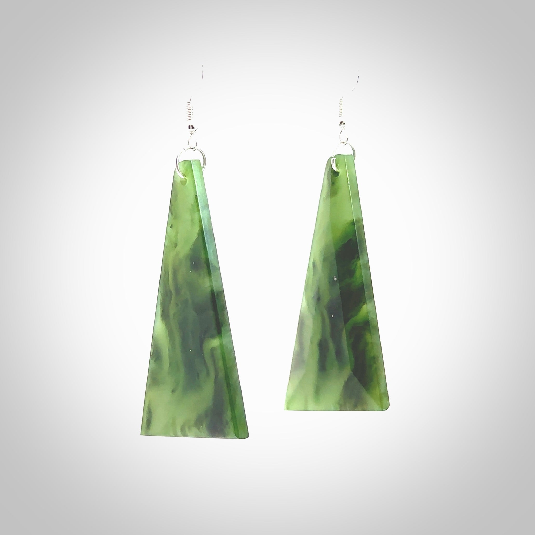 Hand carved New Zealand Jade drop earrings. Hand made large drop earrings with sterling silver. Hand carved New Zealand Jade drop earrings by Rueben Tipene. Delivered in a woven kete pouch.