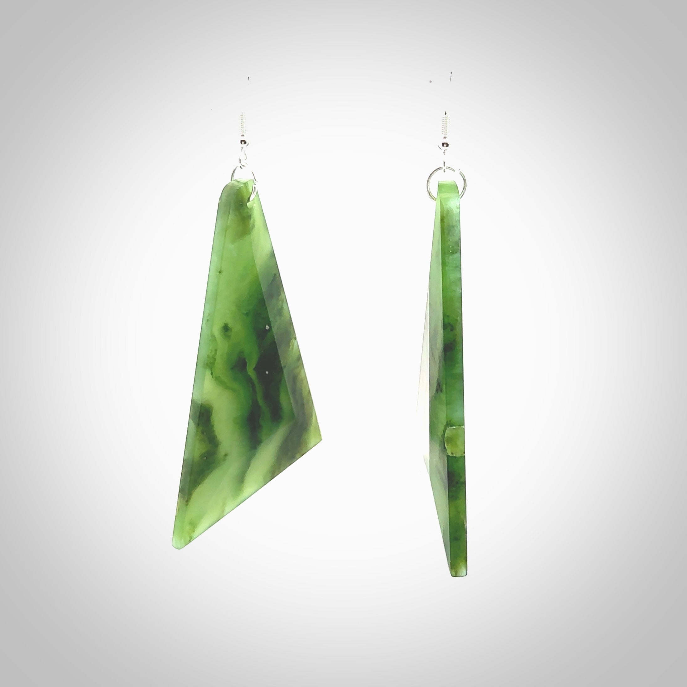 Hand carved New Zealand Jade drop earrings. Hand made large drop earrings with sterling silver. Hand carved New Zealand Jade drop earrings by Rueben Tipene. Delivered in a woven kete pouch.