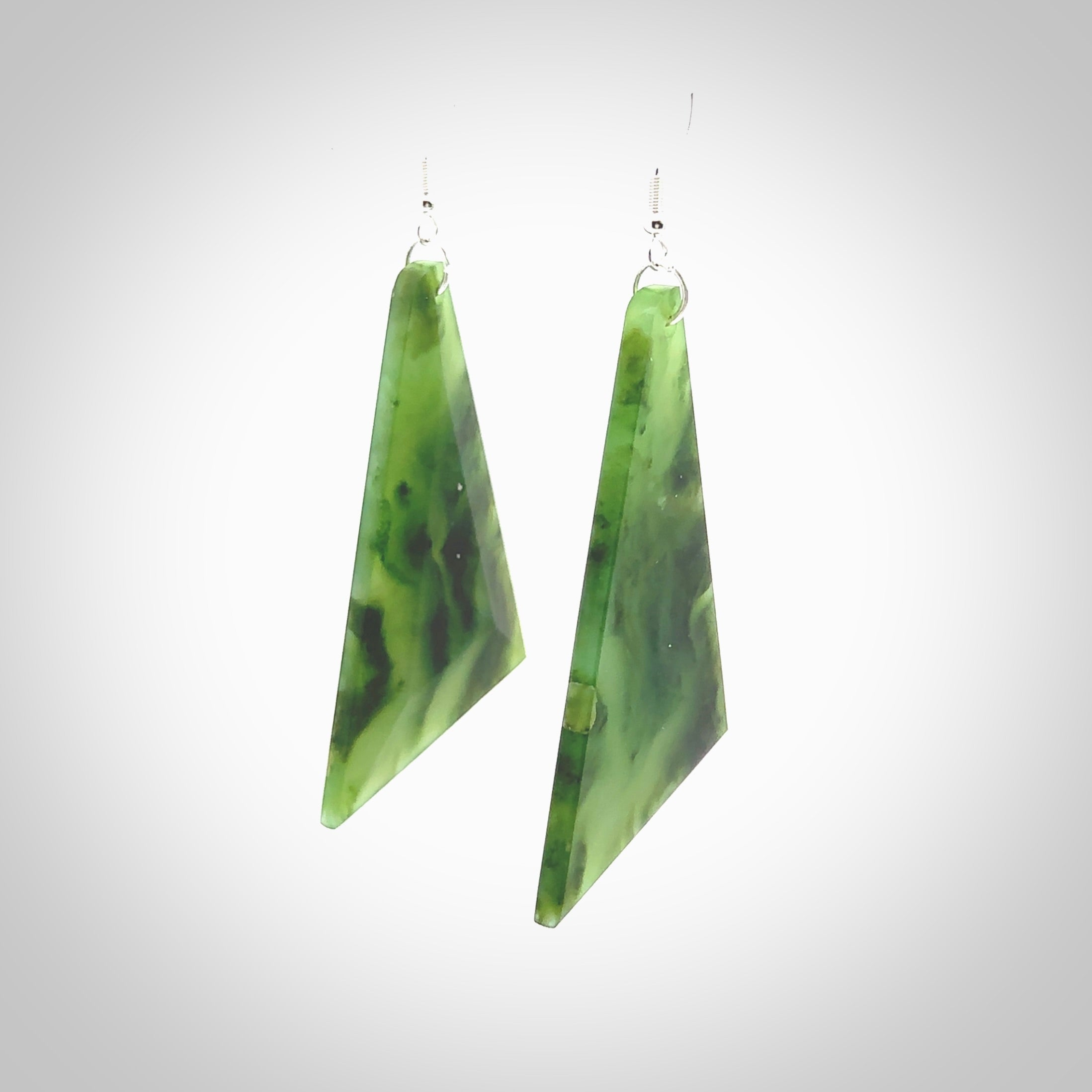 Hand carved New Zealand Jade drop earrings. Hand made large drop earrings with sterling silver. Hand carved New Zealand Jade drop earrings by Rueben Tipene. Delivered in a woven kete pouch.