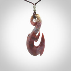 Large hook design pendant carved in Red Agate. Real Agate jewellery for sale online with NZ Pacific. Large hook pendant hand made in red agate, provided with adjustable cord and packaged in a woven kete pouch.