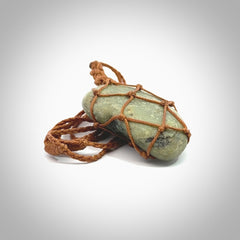 Hand made large New Zealand jade boulder pendant. Hand carved in New Zealand by Ric Moor. Hand made jewellery. Unique large Jade boulder pendant with adjustable length brown coloured cord. Free shipping worldwide.