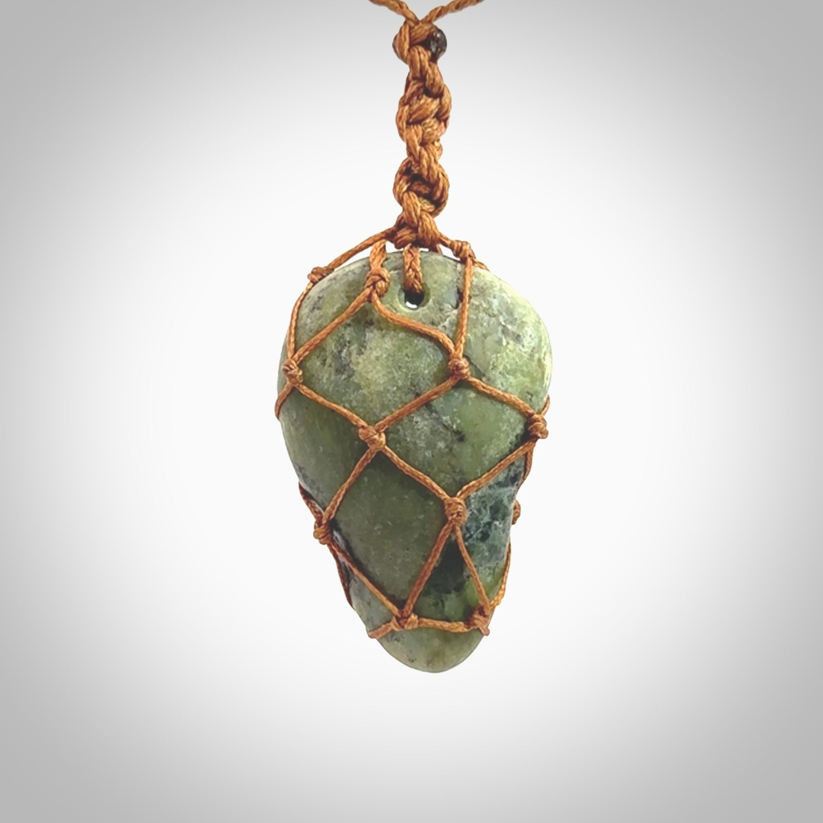 Hand made large New Zealand jade boulder pendant. Hand carved in New Zealand by Ric Moor. Hand made jewellery. Unique large Jade boulder pendant with adjustable length brown coloured cord. Free shipping worldwide.