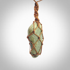 Hand made large New Zealand jade boulder pendant. Hand carved in New Zealand by Ric Moor. Hand made jewellery. Unique large Jade boulder pendant with adjustable length brown coloured cord. Free shipping worldwide.