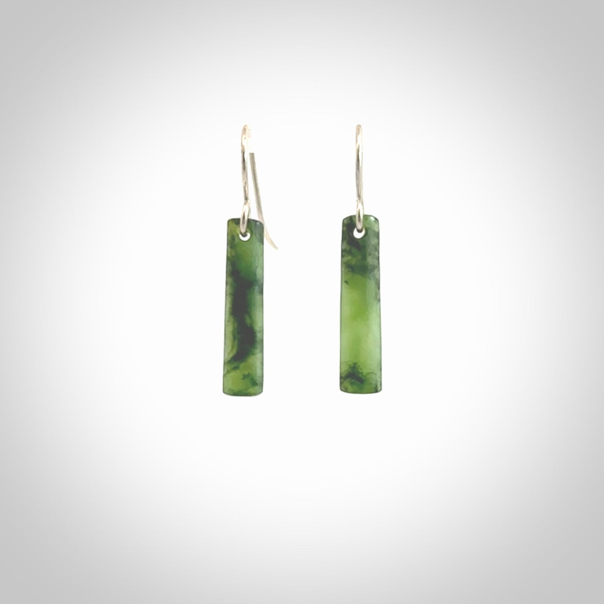 Hand carved small sized New Zealand jade drop earrings. Made by NZ Pacific from real jade. Online jewellery for sale online by NZ Pacific. Medium sized Jade drop earrings hand carved by New Zealand carver Ric Moor.