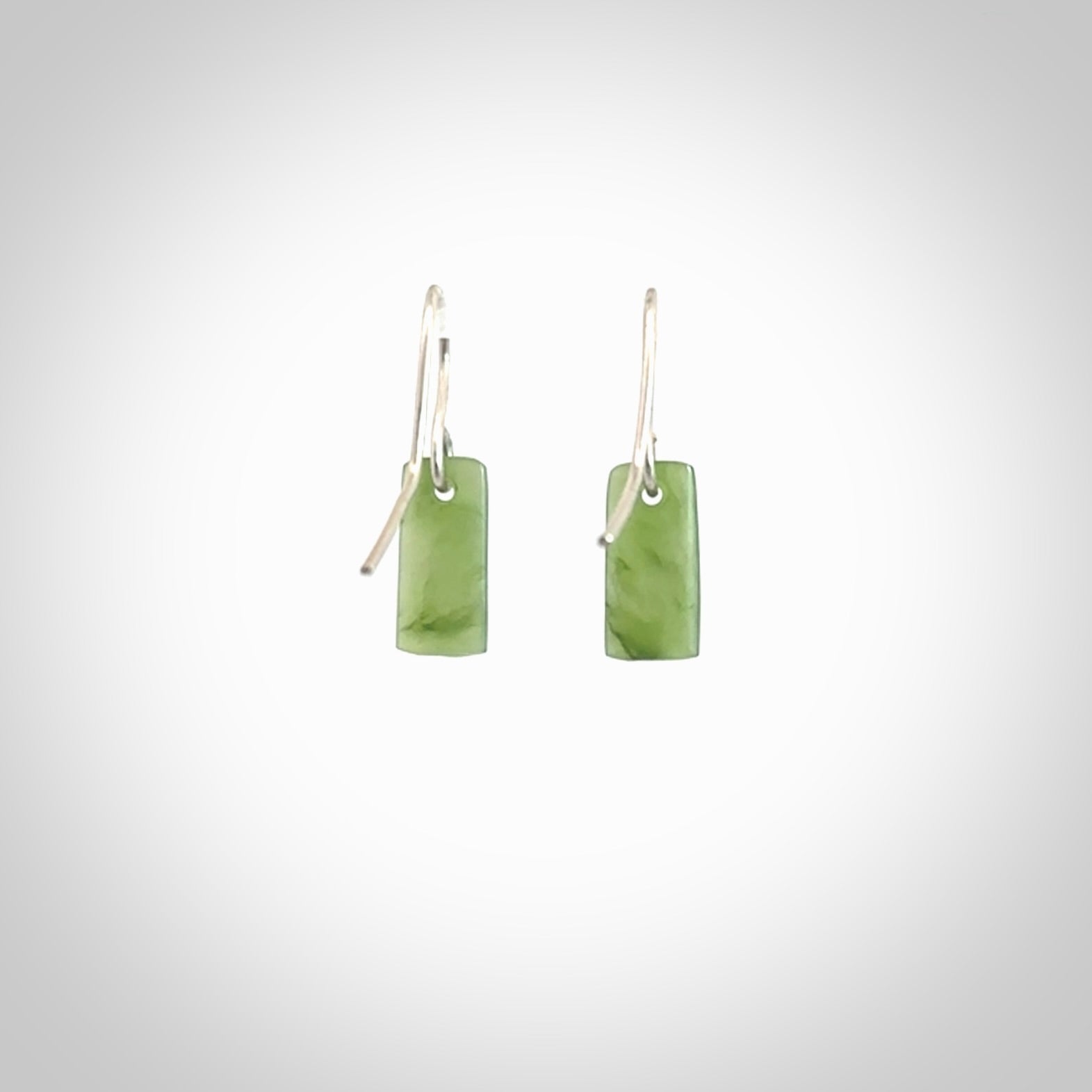 Hand carved small New Zealand jade drop earrings. Made by NZ Pacific from real jade. Online jewellery for sale online by NZ Pacific. Hand carved here in New Zealand by Ric Moor.