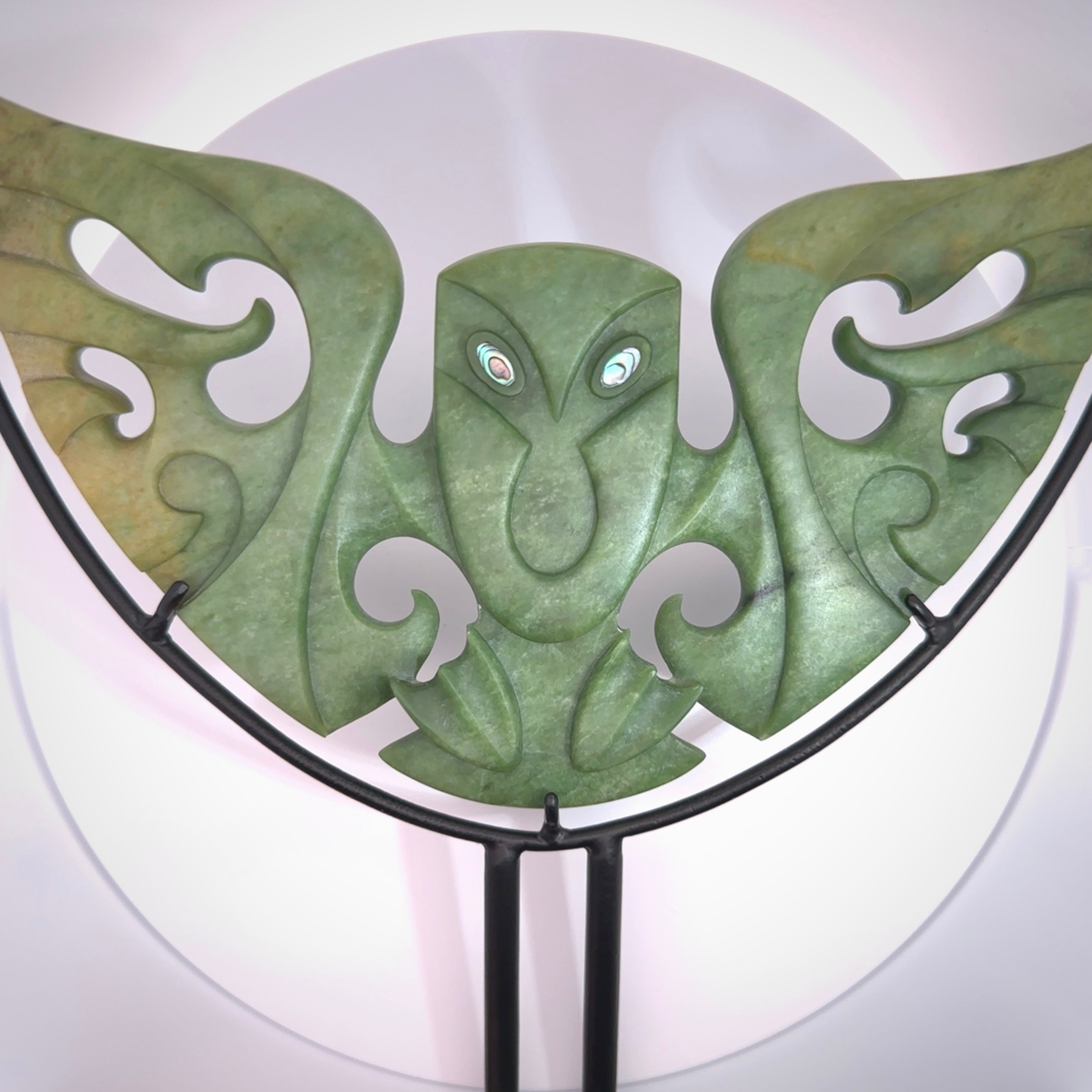 A hand carved New Zealand Jade owl sculpture with Paua shell eyes. A large sized hand made ruru, owl, sculpture by New Zealand artist Kerry Thompson. One off work of art to display.