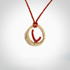 Hand carved incredible Huia bird Deer Antler Bone carving. A stunning work of art, beautifully replicating two huia birds meeting. This pendant was hand carved in Deer Antler with Red Coral by Sami. A one off collectors item that has been hand crafted to be worn or displayed.