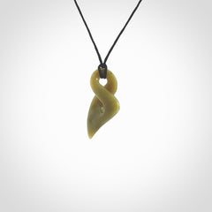 Hand carved small sized, New Zealand jade twist pendant. Carved in New Zealand by NZ Pacific. Hand made small Jade twist with adjustable black cord by Shaun Gardiner.