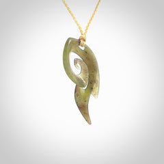 This photo shows a contemporary koru pendant carved from New Zealand Jade. The artist, Shaun Gardiner, has carved this beautifully. We provide this piece with an adjustable oat coloured cord. This is a fantastic work of art, we have one only.