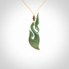 A hand carved New Zealand Jade manaia with hook pendant. Carved for us by Shaun Gardiner. One only medium sized Jade manaia necklace with adjustable cord.