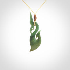 A hand carved New Zealand Jade manaia with hook pendant. Carved for us by Shaun Gardiner. One only medium sized Jade manaia necklace with adjustable cord.