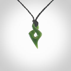 Hand carved small sized, New Zealand jade twist pendant. Carved in New Zealand by NZ Pacific. Hand made small Jade twist with adjustable black cord by Shaun Gardiner.