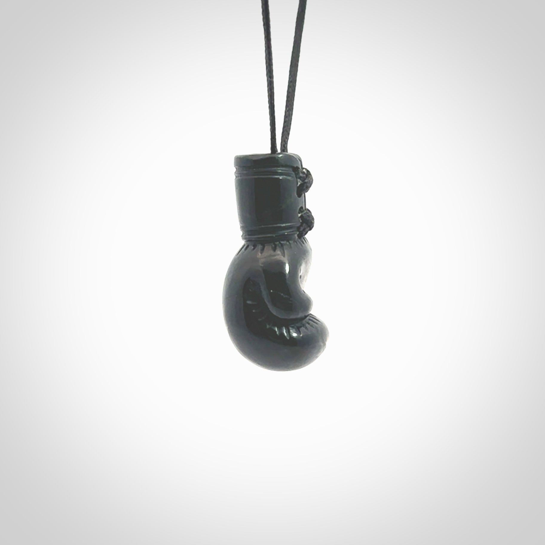 Hand carved boxing glove made from black jade. The cord is adjustable so that you can wear this where it suits you best. We ship these worldwide and the postage is included in the price. 