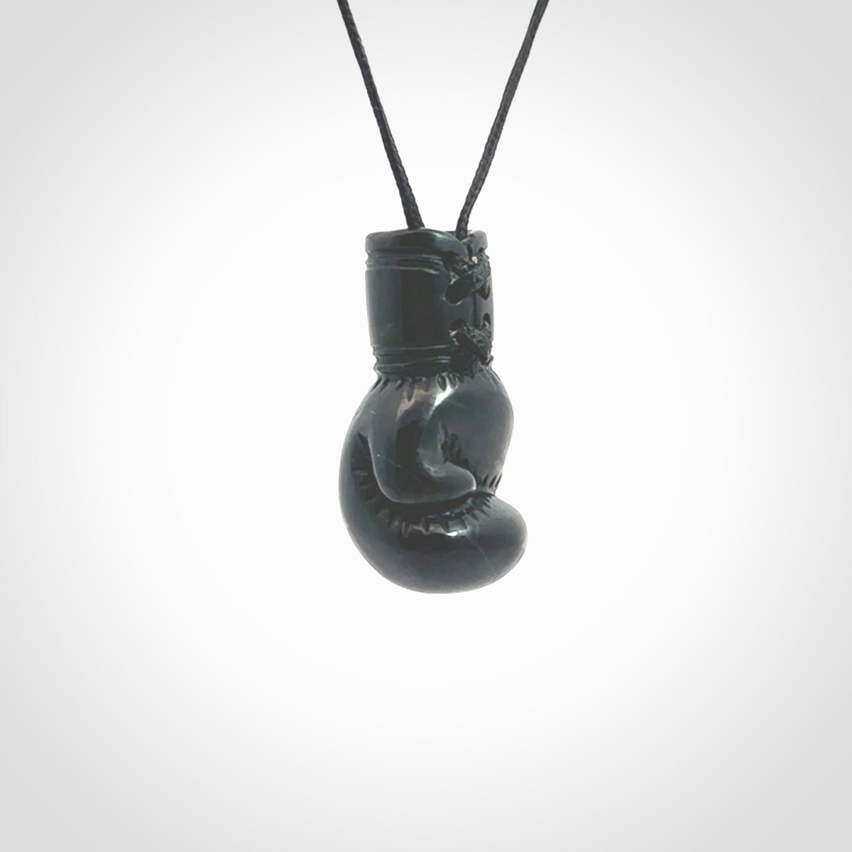 Hand carved boxing glove made from black jade. The cord is adjustable so that you can wear this where it suits you best. We ship these worldwide and the postage is included in the price. 