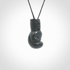 Hand carved boxing glove made from black jade. The cord is adjustable so that you can wear this where it suits you best. We ship these worldwide and the postage is included in the price. 