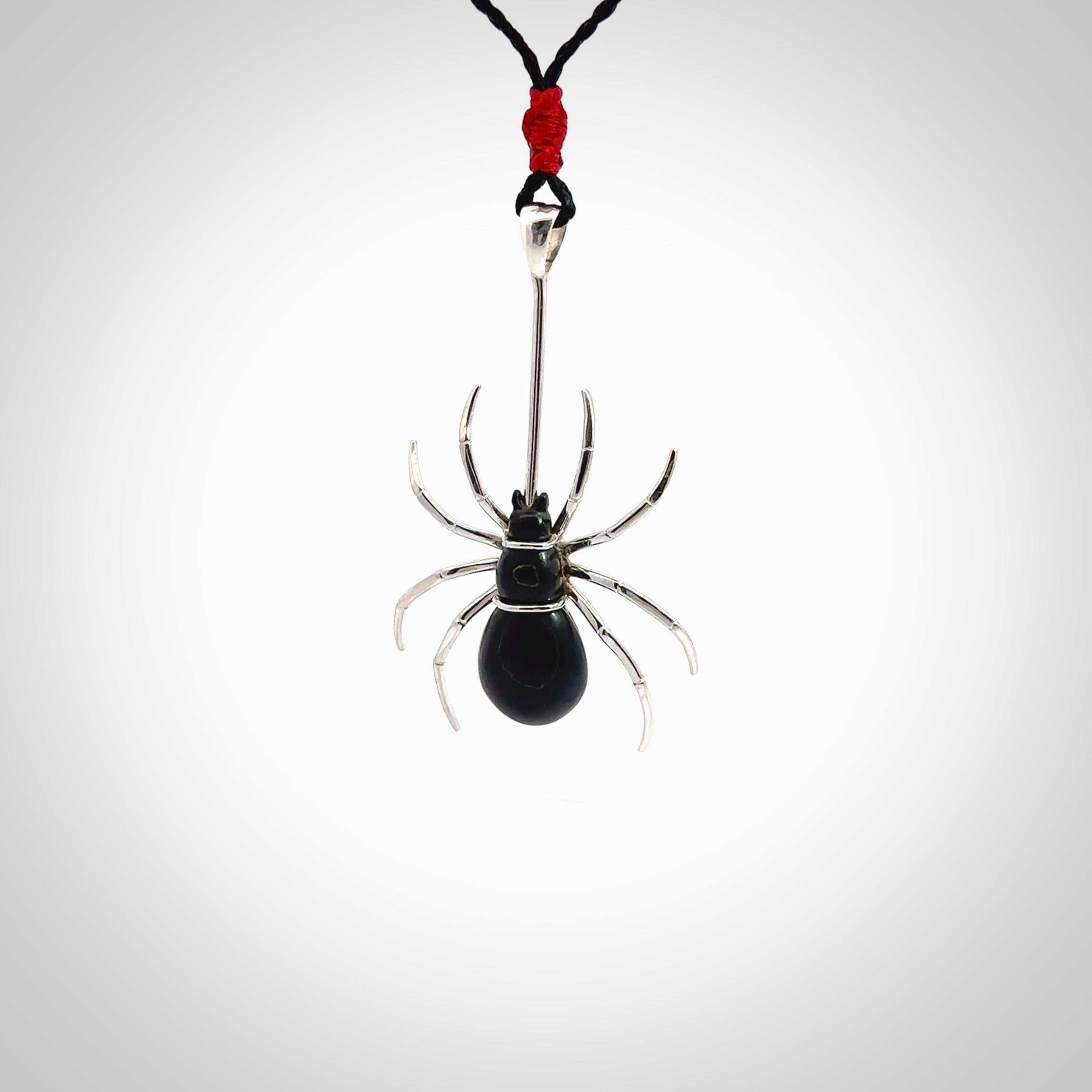 Hand crafted black jade and sterling silver spider necklace. This necklace is provided with a black adjustable cord. Contemporary black jade spider necklace with sterling silver. Delivered with express courier and packaged in a woven kete pouch.