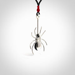 Hand crafted black jade and sterling silver spider necklace. This necklace is provided with a black adjustable cord. Contemporary black jade spider necklace with sterling silver. Delivered with express courier and packaged in a woven kete pouch.