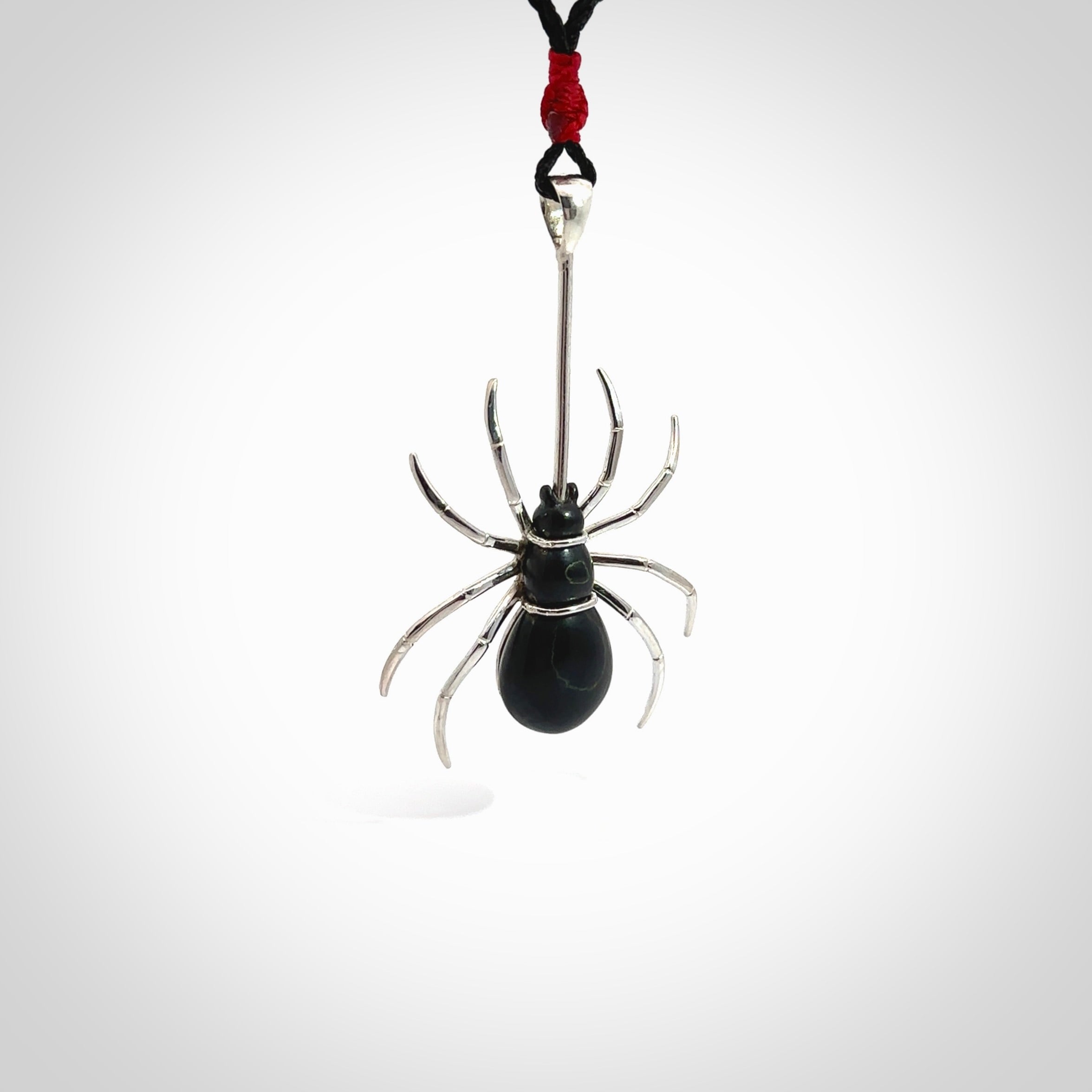 Hand crafted black jade and sterling silver spider necklace. This necklace is provided with a black adjustable cord. Contemporary black jade spider necklace with sterling silver. Delivered with express courier and packaged in a woven kete pouch.