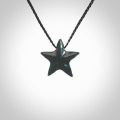 Hand carved black jade star pendant. Hand made black jade star pendant with adjustable cord.